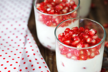 closeup Delicious dessert with fresh pomegranate seeds in a glas