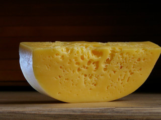 A piece of cheese on the table