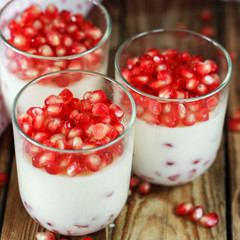 closeup Delicious dessert with fresh pomegranate seeds in a glas