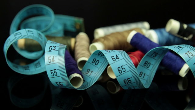 multicolor threads and measuring tape