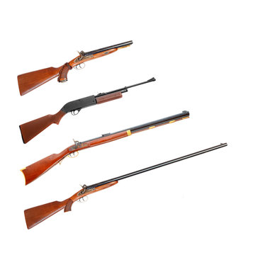 Collection of hunting rifles on white background.
