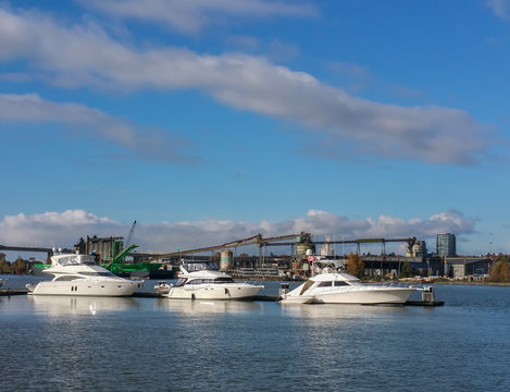 Recreational boats against industrial background