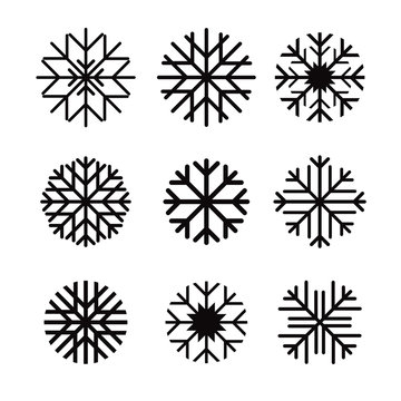 Set of black vector snowflakes