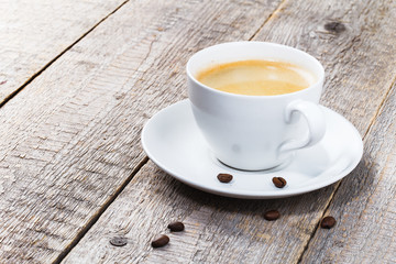 cup of coffee on wooden background