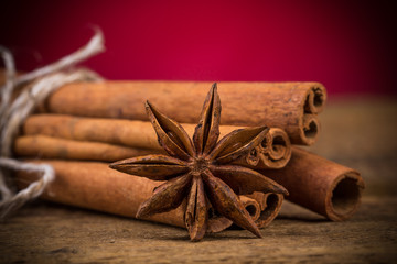 Close up of cinnamon sticks and star anise on wood