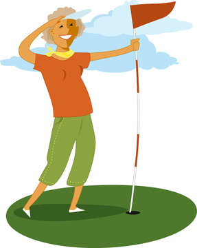 Mature woman holdinf a golf flag