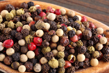 Color pepper on wooden spoon