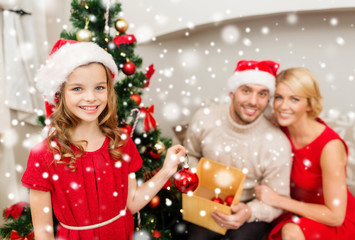 Fototapeta na wymiar smiling family decorating christmas tree at home