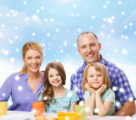 happy family with two kids having breakfast