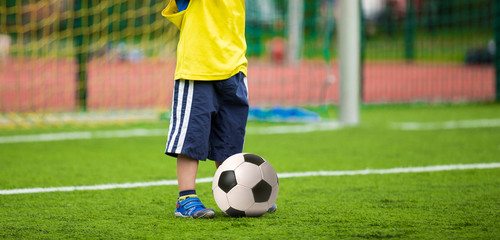 kid playing football soccer match