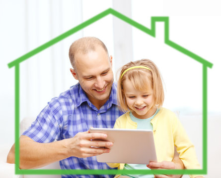 happy father and daughter with tablet pc computer