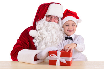 Christmas theme: Santa Claus and child having a fun.