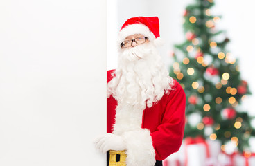 man in costume of santa claus with billboard