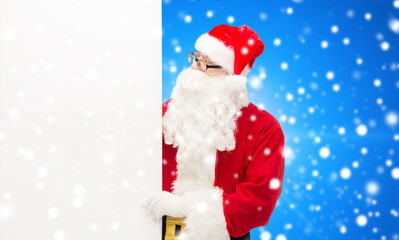 man in costume of santa claus with billboard