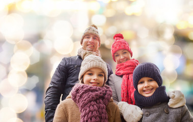 happy family in winter clothes outdoors