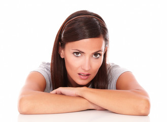 Obraz premium Unsmiling beautiful female looking at camera