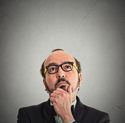 middle aged man thinking looking up copy space above head