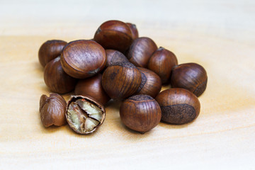 Chestnut on wood background.
