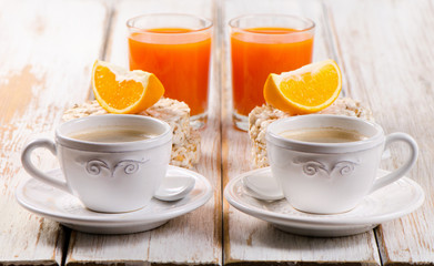 Healthy breakfast with two   coffee cup and orange juice