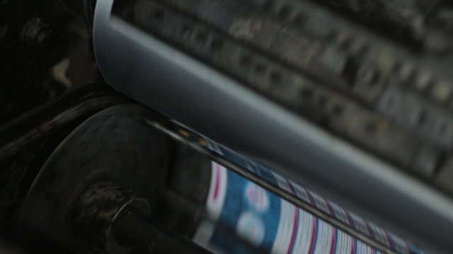 The process of rotation of printer drum at the printing house