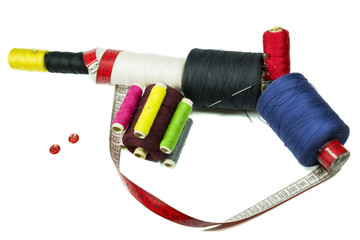 Machine gun with sewing buttons and tailor tape