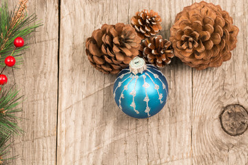 Christmas baubles and pine cones top view