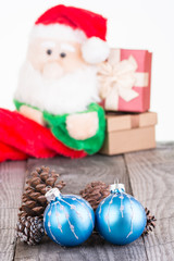 Fototapeta na wymiar Christmas baubles and Santa Claus toy
