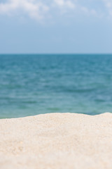 Fototapeta na wymiar Sandy beach with horizon over blue sea background