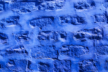 Blue painted brick wall in Jodhpur, India.