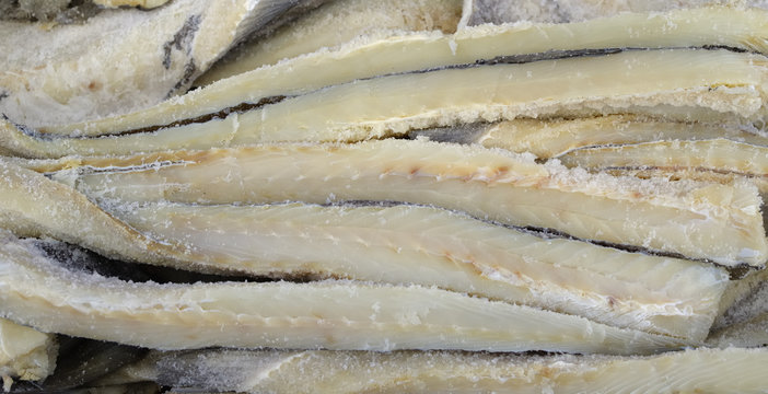Exposure salted cod in a market of the country. Shallow focus