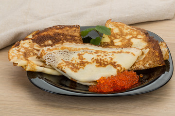 Pancakes with red caviar