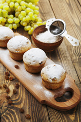 Homemade muffins with raisins and powdered sugar