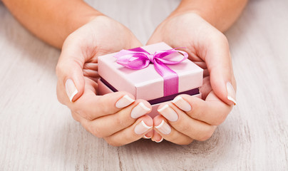 Small gift in women hands