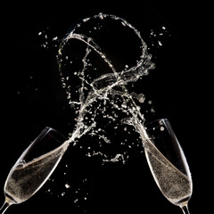 Champagne flutes on black background