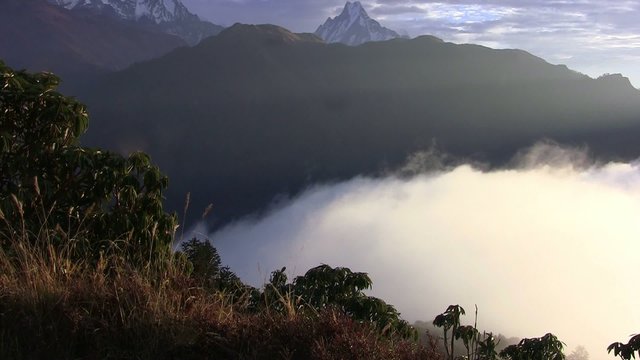 Thick clouds cover the ground in the Himalayas. Nepal.