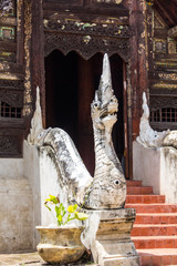 Naga statue staircase with old wood chapel