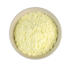 Aerial view of milk powder in a bowl isolated on white