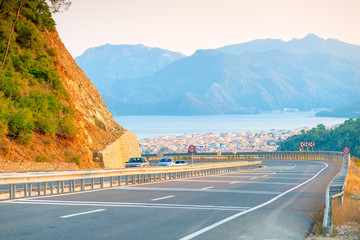 Pass mountain road and city views