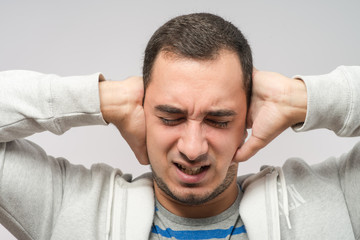 Obraz premium Man covering his hears