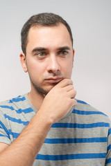 Depressed young man  holding head in hands