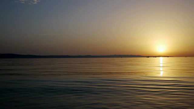 Landscape view at calm sea in sunset