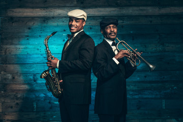 Two vintage african american jazz musicians with trumpet and sax