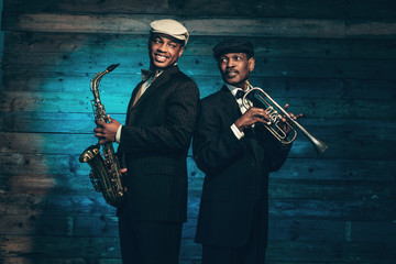 Two vintage african american jazz musicians with trumpet and sax