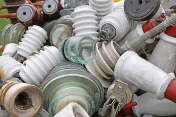 old ceramic insulators in an old dump obsolete material