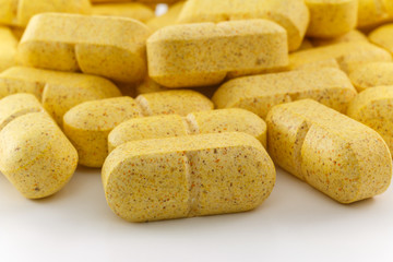 Close up several yellow pills