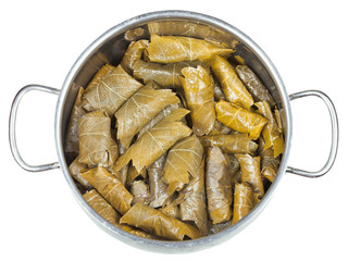 dolma from vine leaves and mince in stewpan
