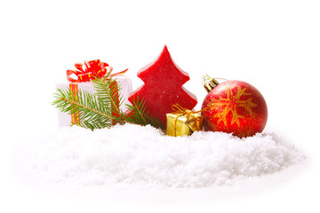 Gifts and red christmas ball isolated on white. 