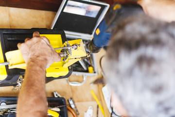 Man making hole with electric drill