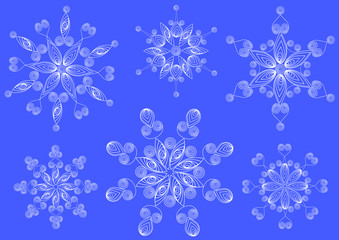 Snowflakes in the technique of quilling .