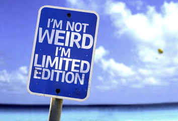 I'm Not Weird Im Limited Edition sign with a beach
